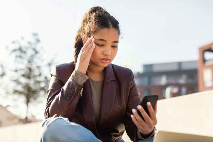 parent worrying about a child's cell phone use